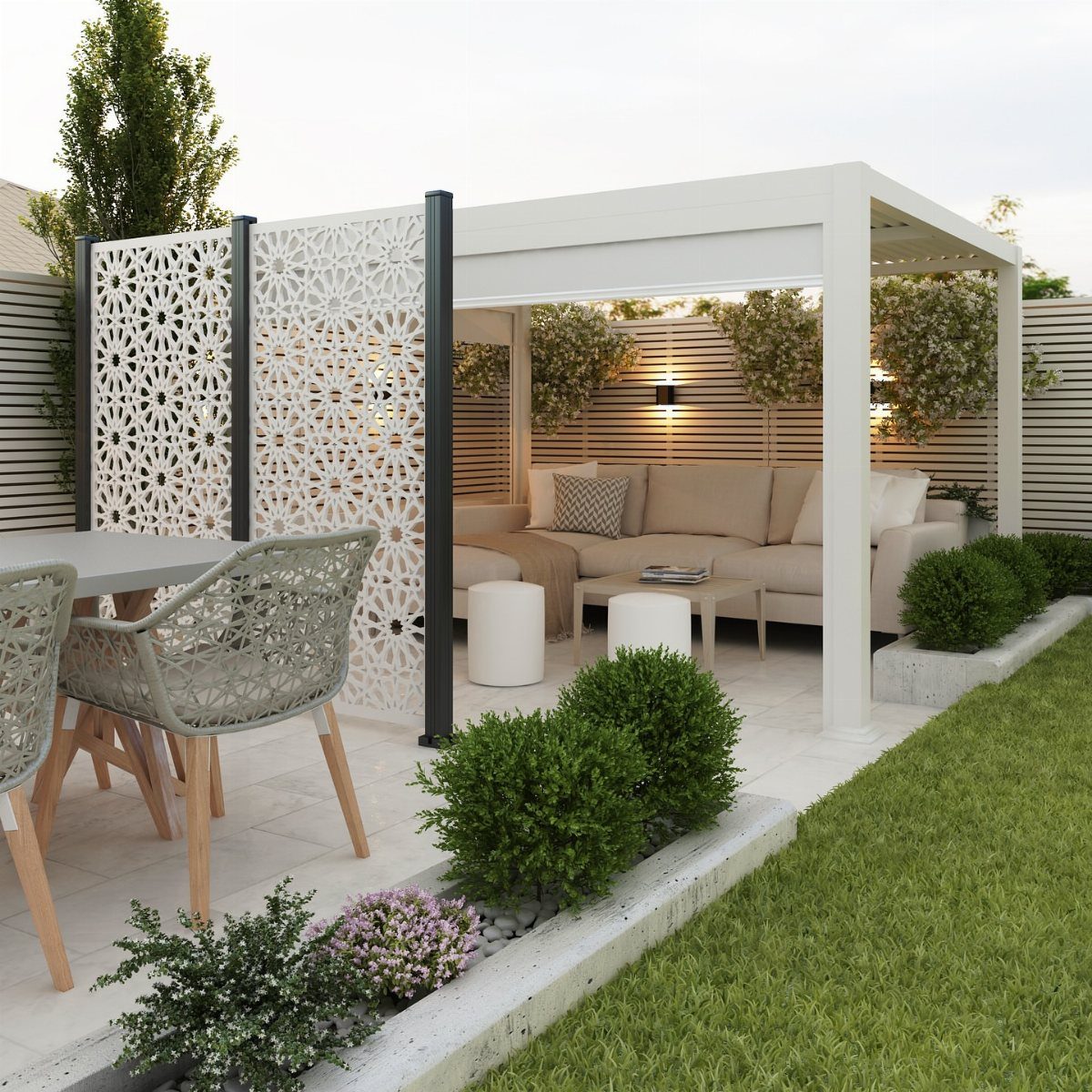 21 Backyard Deck Ideas For Any Size Space 6 White laser-cut geometric privacy screens standing next to a modern outdoor lounge area.