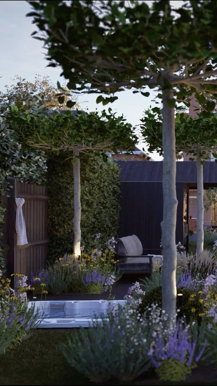 23 Backyard Garden Inspiration Ideas for Any Space 12 Manicured canopy trees and purple flowering plants surround a modern backyard garden area.