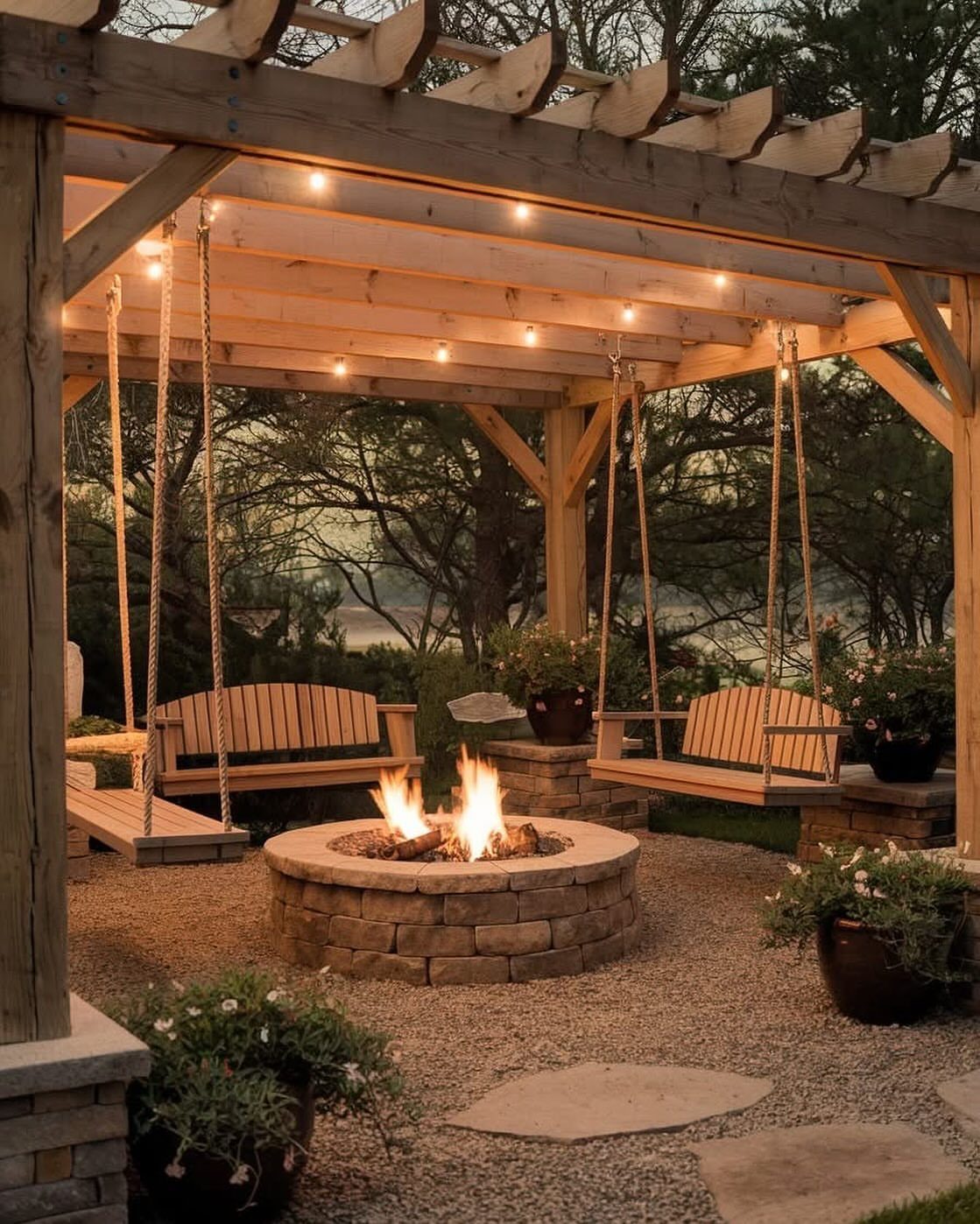 23 Backyard Garden Inspiration Ideas for Any Space 4 Wooden pergola with hanging swings and a stone fire pit on a gravel patio.
