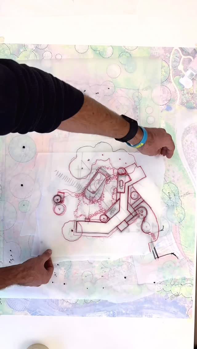 Garden Design Drawing: 11 Layouts and Sketches to Try 8 Hands holding a translucent garden design drawing over a colorful watercolor landscape plan.